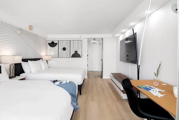 Relax in your studio with 2 queen-sized beds and 65" Smart TV