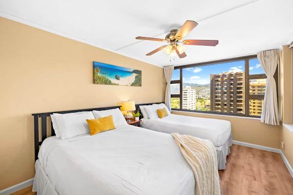 The bedroom offers a Queen and a Full bed, perfect for family or friends, along with mountain and city views right from your window.