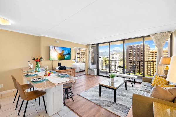 Enjoy stunning city and mountain views from this bright, open-concept condo featuring a comfortable living area, dining space, and private balcony.