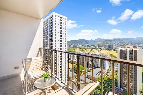 Sip your coffee on the private balcony and take in the spectacular, elevated views of the city, surrounding high-rises, and distant mountains.