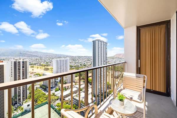 Sip your coffee on the private balcony and take in the spectacular, elevated views of the city, surrounding high-rises, and distant mountains.