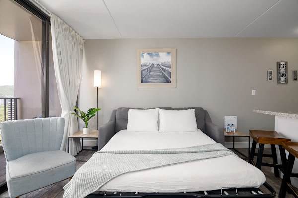 The living area features a comfortable sleeper sofa perfect for relaxing.