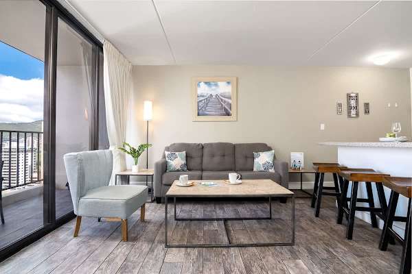 Pull-out sleeper sofa, coffee table, and chair in the living area