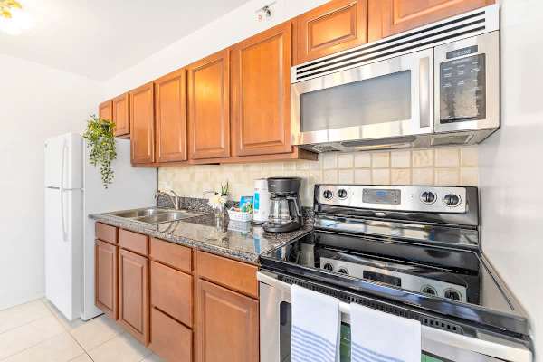 kitchen with stainless steel appliances and wooden cabinetry