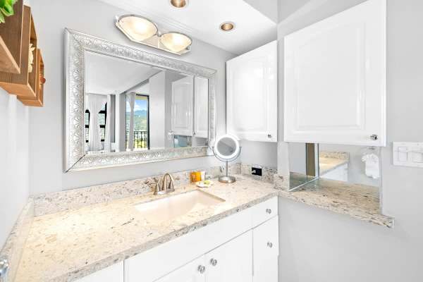 Full bathroom with vanity and cabinet.