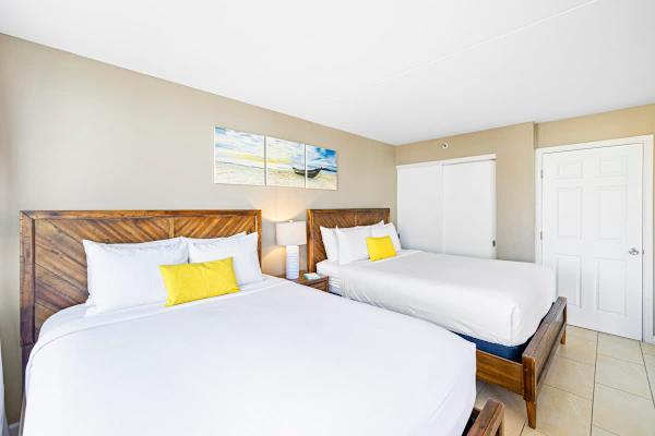 The bedroom has 2 queen-size beds, nightstand, and closet!