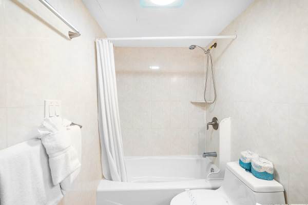 Full bathroom is equipped with tub and a shower!
