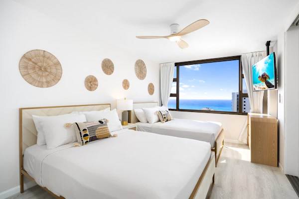 Rest easy in style with a queen and full-size bed setup, perfectly positioned to wake up to sparkling ocean views. 
