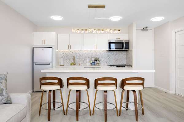 A chef-ready kitchen and spacious breakfast bar designed for seamless living and social mornings.