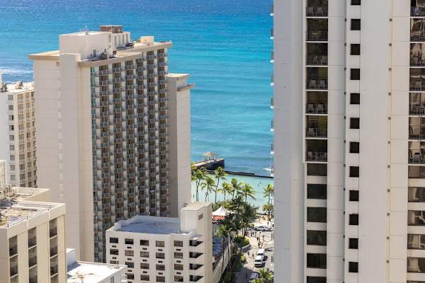 Elevate your stay with panoramic views that stretch from the bustling city streets to the endless blue horizon.