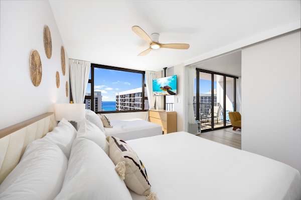 Rest easy in style with a queen and full-size bed setup, perfectly positioned to wake up to sparkling ocean views. Plus, enjoy watching your favorite shows while in your bed.