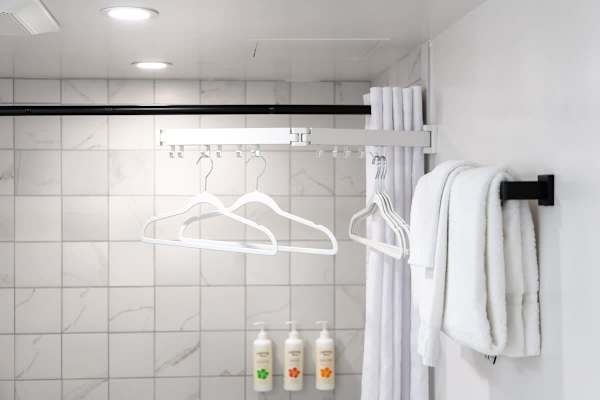 Enjoy the convenience of a dedicated drying rack, complimentary amenities, and fresh towels!
