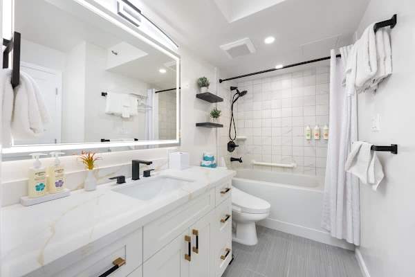 Your full bathroom features a tub/shower combo, vanity with cabinets, and a toilet with a bidet! 