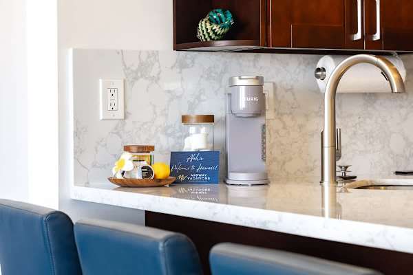 Start your day with a cup of coffee from this Keurig coffee maker and complimentary coffee!