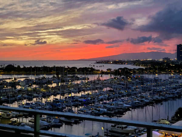 End your perfect Hawaiian day witnessing the magic of a fiery sunset painting the sky over the Ala Wai Harbor and Diamond Head!