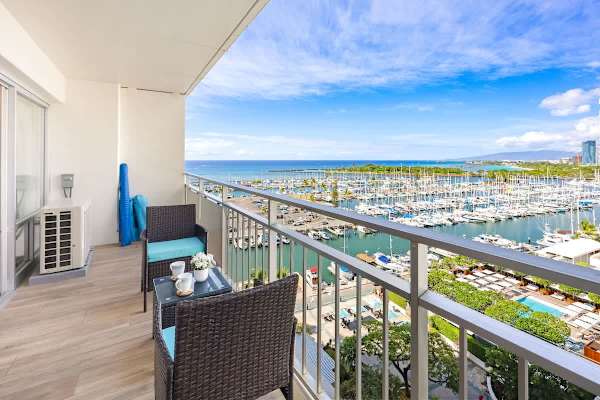Savor the stunning, expansive views of the Ala Wai Yacht Harbor and the Pacific Ocean from your balcony!