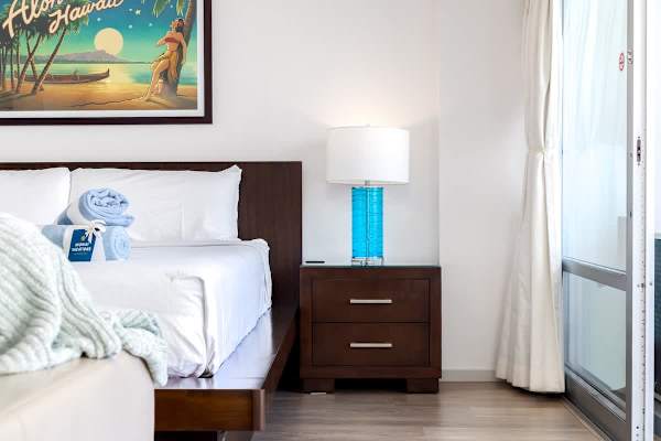Bed details and dresser in the unit.