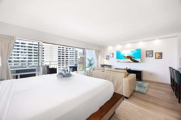 Your studio features a cozy king bed, a sleeper sofa, and a balcony perfect for watching the Waikiki world go by.