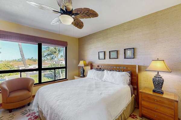 Bright Primary Suite with King Bed, Tropical Ceiling Fan & Ocean-Breeze Windows