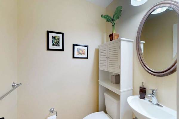 Guest Powder Room with Pedestal Sink & Storage Cabinet