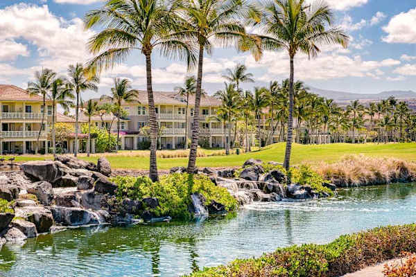 Lush resort grounds feature Green resort lawn provides palm-lined space for peaceful outdoor enjoymentFirst bedroom features ceiling fan comfortable bedding and window lightFirst bedroom features comfortable bedding ceiling fan and natural lightpalm trees lawns and water views