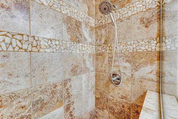 Refresh in the Beautiful Stone Walk-In Shower