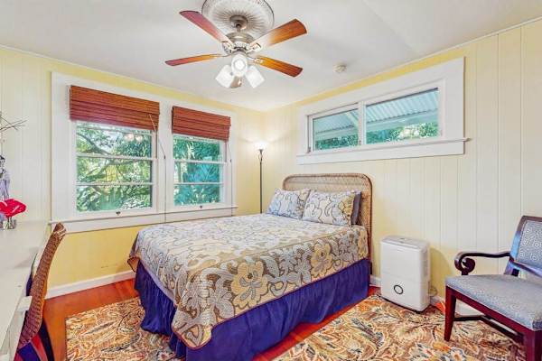 Sunny Guest Bedroom With Tropical Views