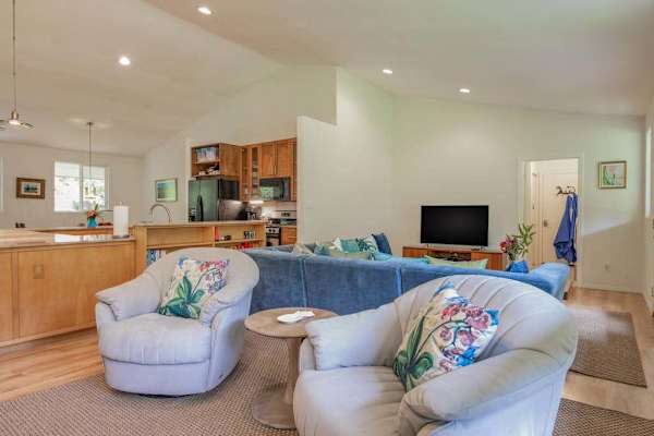 Sunlit Living Room with Plush Swivel Armchairs