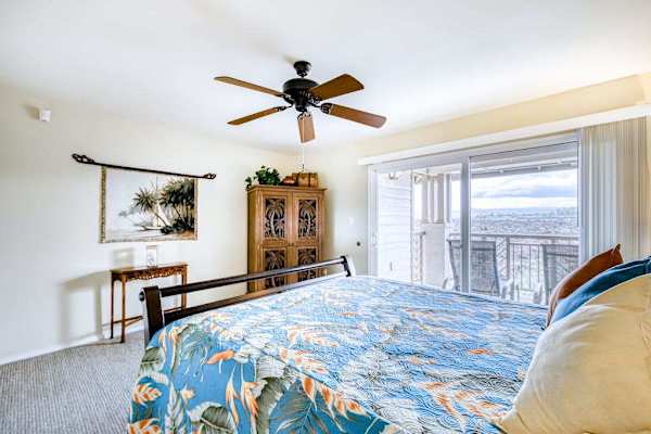 Spacious king bedroom with TV and lanai access