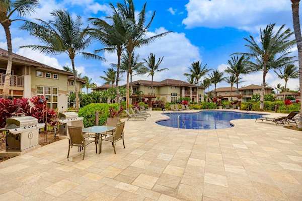Tropical pool surrounded by lush landscaping
