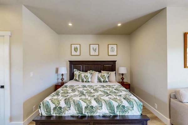 Cozy Bedroom Nook Featuring Tropical Palm Bedding & Framed Art