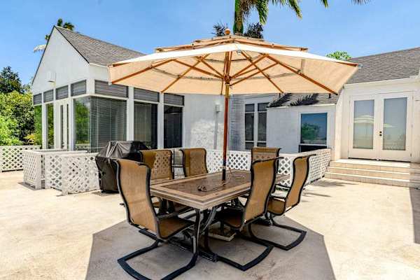Balcony dining area with BBQ creates the perfect setting for shared memorable meals