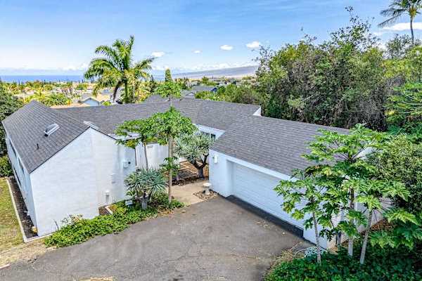 Soaring above, admire the beautiful home surrounded by captivating landscapes and scenic views