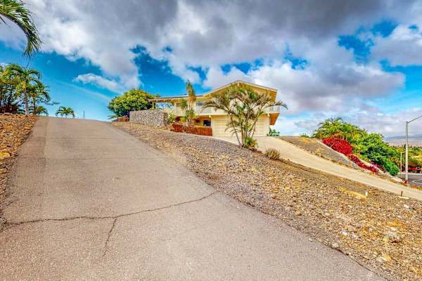 Driveway provides easy arrival with convenient parking for guests onsite
