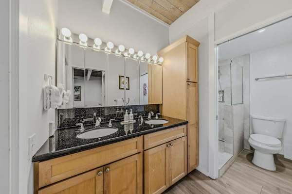 Bright Executive Bathroom With Double Vanity And Ample Storage