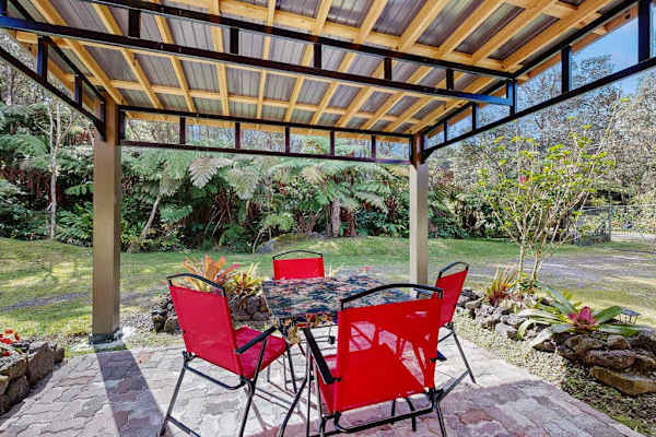 Outdoor Gazebo Dining Space with Table & Chairs in Lawn Setting