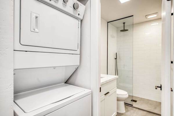 Convenient In-Unit Stacked Laundry Makes Beach Trips Effortless