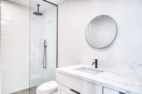 Sleek Round Mirror Accents Complement A Bright Clean Space