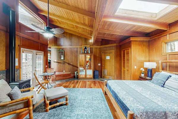 Spacious bedroom with a cozy seating area
