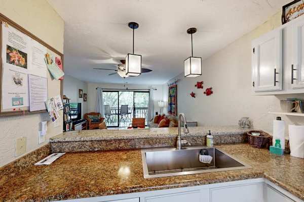 Kitchen bar overlooking living/dining area 