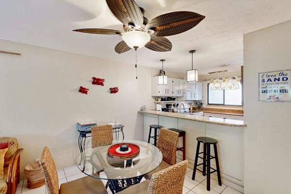 Small dinning area with rattan furniture and tropical ceiling fan