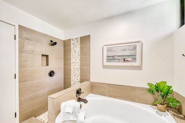 Walk in shower and soaking tub create relaxing bathroom retreat