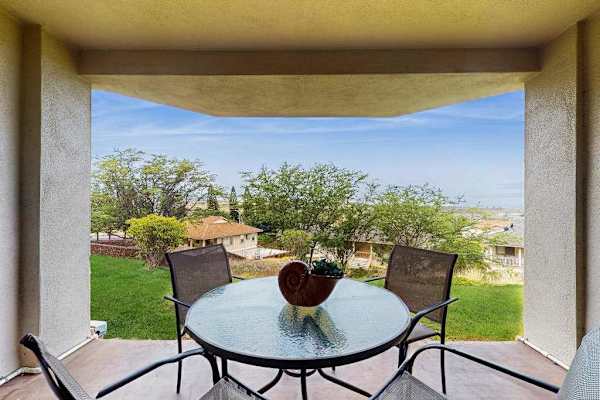 Private lanai with outdoor dining and ocean views.
