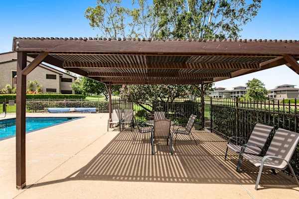 Shaded Poolside Pavilion For Outdoor Gatherings