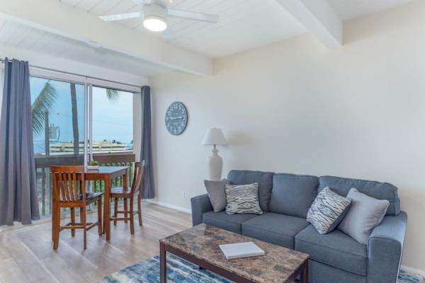 Plush Sofa, Coffee Table, Dining High-Top Table & Balcony Access