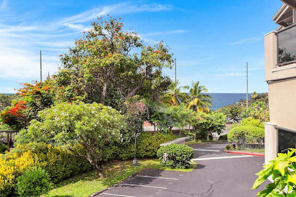 Lush Property Exterior & Surrounding Landscape with Distant Ocean View