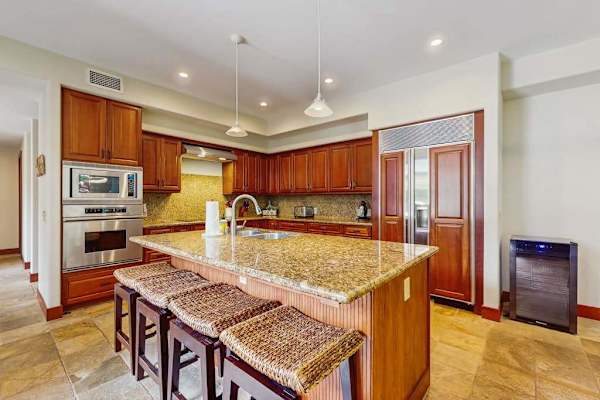 Upgraded kitchen with all of the amenities and stainless steel appliances.  Large island for extra counter space and with four barstools.