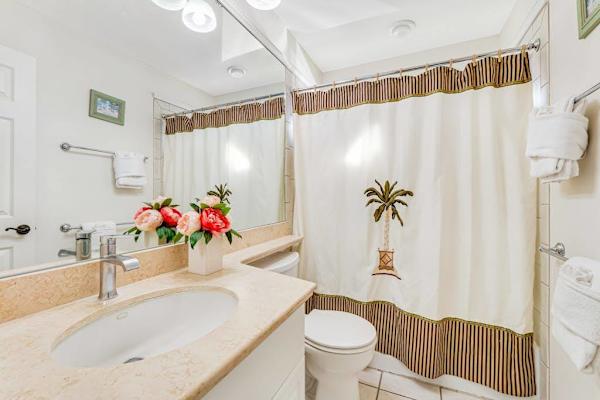 Guest bathroom with tub/shower combo.