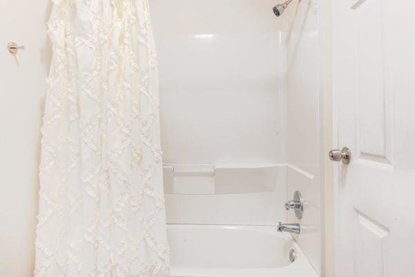 Full bathroom with tub/shower combo.