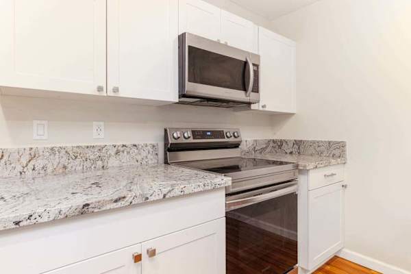 Large open air kitchen with upgraded appliances.